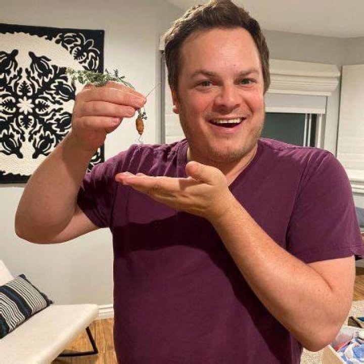 Dan Gregor is showing tiny carrot. 