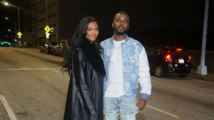 Falynn Guobadia posing with her ex-husband by wearing black one piece.