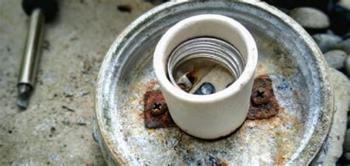 How do you clean corroded light sockets?