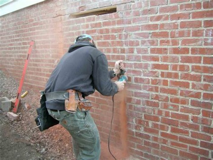 How do you install a window in a brick wall?