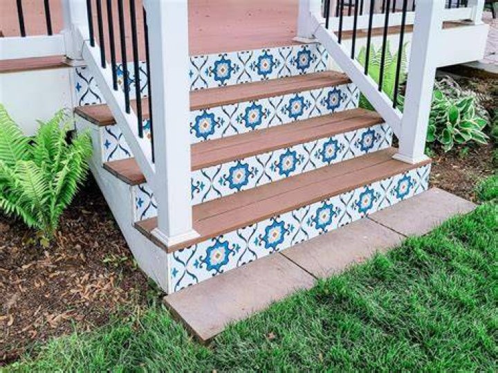How do you install ceramic tile on stair risers?