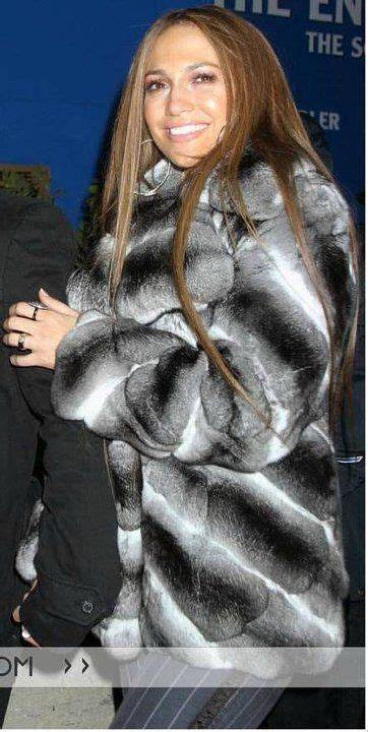 Jennifer Lopez teams a chinchilla coat with boxing-inspired shoes, shorts and crop top while filming her latest music video 'Amor' in the early hours of Friday morning in Manhattan's Soho neighbourhood