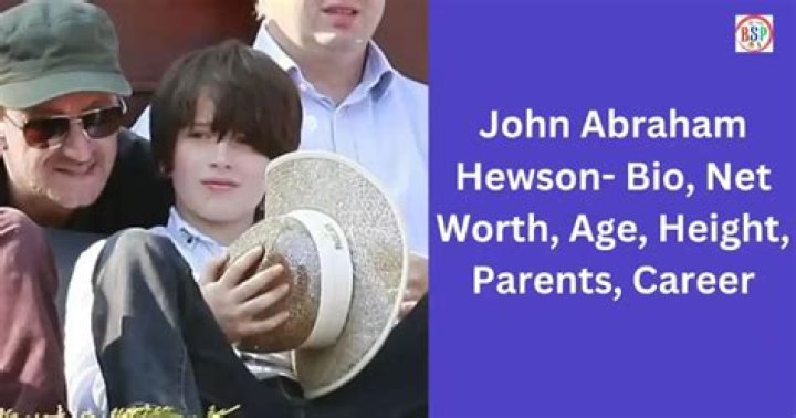 John Abraham Hewson acting to fall asleep on his sister's arms.