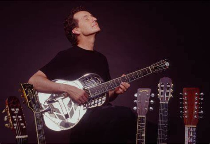 John Schneider With His Guitar