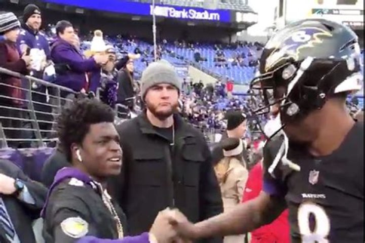 Lamar Jackson celebrating with Kodak Black after Baltimore Ravens win