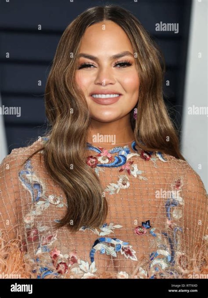 Model Chrissy Teigen wearing a Georges Hobeika dress arrives at the 2019 Baby2Baby Gala held at 3Labs on November 9, 2019 in Culver City, Los Angeles, California, United States.