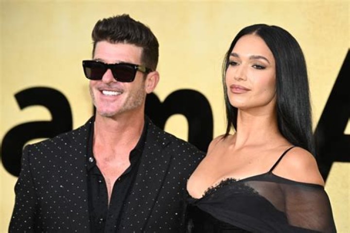 Robin Thicke and April Love Geary out at the Los Angeles Lakers game