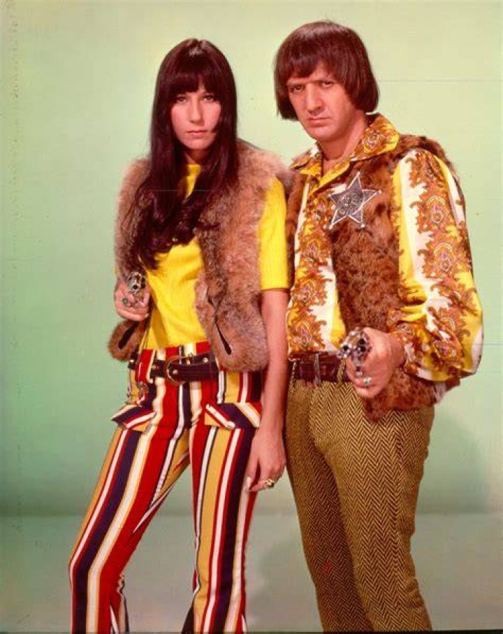 Sony and Cher in front of their first mansion